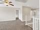 Spacious bonus room with neutral carpeting, ceiling fan and view to the hallway at 1307 Summer Dawn Ave, Henderson, NV 89014