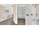 Bright hallway with carpet and natural light, adjacent to a bathroom and additional rooms at 1307 Summer Dawn Ave, Henderson, NV 89014