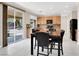 Bright eat-in kitchen features tile floors, light wood cabinets, granite counters, and stainless steel appliances at 1307 Summer Dawn Ave, Henderson, NV 89014