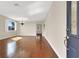 Spacious living room boasts gleaming hardwood floors, neutral paint, plantation shutters, and ample natural light at 1307 Summer Dawn Ave, Henderson, NV 89014