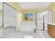 Bright main bathroom with a stand-alone shower, a separate soaking tub, and a walk in closet at 1307 Summer Dawn Ave, Henderson, NV 89014