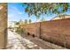 Practical side yard with secure fencing and low-maintenance gravel, ideal for added privacy and utility at 1307 Summer Dawn Ave, Henderson, NV 89014