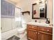 Bathroom featuring a shower-tub combo, single sink vanity, and tile flooring at 1636 Royal Palm Dr, Las Vegas, NV 89128