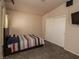 Comfortable bedroom with carpeted floors and a closet at 1636 Royal Palm Dr, Las Vegas, NV 89128