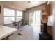 Bright kitchen nook with tile flooring, large windows, and access to the backyard at 1636 Royal Palm Dr, Las Vegas, NV 89128