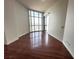Bedroom features floor to ceiling windows with city views and wood flooring at 200 W Sahara Ave # 3909, Las Vegas, NV 89102