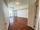 Bright bedroom featuring gleaming hardwood floors and floor-to-ceiling window with city views at 200 W Sahara Ave # 3909, Las Vegas, NV 89102