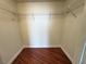 Walk-in closet featuring wire shelving and wood flooring at 200 W Sahara Ave # 3909, Las Vegas, NV 89102