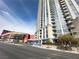 Modern high-rise building featuring sleek architecture and multiple balconies near a city street at 200 W Sahara Ave # 3909, Las Vegas, NV 89102