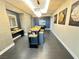 Hallway with modern lighting, unique artwork, and a stylish table with seating at 200 W Sahara Ave # 3909, Las Vegas, NV 89102