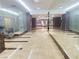 Luxury hallway with gleaming floors, mirrored walls, ambient lighting, and serene seating area at 200 W Sahara Ave # 3909, Las Vegas, NV 89102