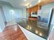 Modern kitchen with stainless steel appliances, granite countertops, and dark wood cabinetry at 200 W Sahara Ave # 3909, Las Vegas, NV 89102