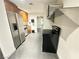 Kitchen area featuring stainless steel appliances, wood cabinets, and tiled flooring at 200 W Sahara Ave # 3909, Las Vegas, NV 89102