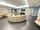 Modern lobby showcasing a large circular sofa, wood floors and contemporary artwork at 200 W Sahara Ave # 3909, Las Vegas, NV 89102