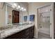 Bathroom features double sinks, granite countertops, and a glass door shower at 2125 Mateuse St, Logandale, NV 89021