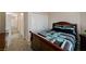Comfortable bedroom with carpet, and a well-lit closet at 2125 Mateuse St, Logandale, NV 89021