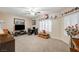 Bedroom with ceiling fan, shuttered windows, and plush carpeting at 2125 Mateuse St, Logandale, NV 89021