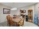 Open-concept dining room features a view of the adjacent kitchen and light colored walls at 2125 Mateuse St, Logandale, NV 89021