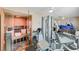 Home gym features a built-in wooden sauna, lots of natural light, and various exercise equipment at 2125 Mateuse St, Logandale, NV 89021
