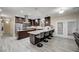 Stylish kitchen with granite counters, stainless appliances, and modern bar seating at 2125 Mateuse St, Logandale, NV 89021