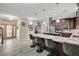 Open-concept kitchen featuring a large island with bar seating and stainless appliances at 2125 Mateuse St, Logandale, NV 89021