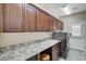 Spacious laundry room featuring ample counter space and plenty of storage cabinets at 2125 Mateuse St, Logandale, NV 89021