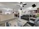 Inviting living room showcasing ceiling fan, comfortable seating, and neutral decor at 2125 Mateuse St, Logandale, NV 89021