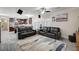 Bright living room featuring tile floor, stylish sofas, and ceiling fan at 2125 Mateuse St, Logandale, NV 89021