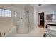 Luxurious main bathroom with a marble soaking tub and frameless glass shower enclosure at 2125 Mateuse St, Logandale, NV 89021