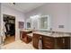 Elegant bathroom with a granite-topped vanity and a walk-in closet for added storage at 2125 Mateuse St, Logandale, NV 89021