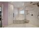 Stylish bathroom with a separate soaking tub and shower, enhanced by natural light at 2125 Mateuse St, Logandale, NV 89021