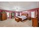 Spacious main bedroom suite with carpet, crown molding, and abundant natural light at 2125 Mateuse St, Logandale, NV 89021