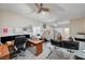 Spacious office featuring multiple work stations, natural light, and neutral carpet at 2125 Mateuse St, Logandale, NV 89021