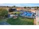 Backyard oasis with a sparkling pool and lush green lawn at 2125 Mateuse St, Logandale, NV 89021