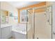 Modern bathroom with a soaking tub and glass-enclosed shower at 2320 Anderson Park Dr, Henderson, NV 89044