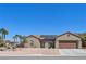 Charming single-story home with desert landscaping, solar panels, and a two-car garage at 2320 Anderson Park Dr, Henderson, NV 89044
