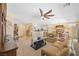 Comfortable living room with ceiling fan and seamless flow to kitchen and dining at 2320 Anderson Park Dr, Henderson, NV 89044