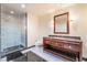 Well-lit bathroom with a glass shower, vanity with drawers and cabinet, plus a toilet at 2700 Las Vegas Blvd # 4101, Las Vegas, NV 89109
