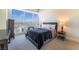 Comfortable bedroom with large windows offering stunning city views, stylish furniture, and plush bedding at 2700 Las Vegas Blvd # 4101, Las Vegas, NV 89109