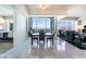 Elegant dining area featuring marble floors, a sleek table, and expansive windows showcasing city and mountain views at 2700 Las Vegas Blvd # 4101, Las Vegas, NV 89109