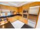 Close up of a modern kitchen with granite countertops, stainless steel appliances, and wood cabinetry at 2700 Las Vegas Blvd # 4101, Las Vegas, NV 89109