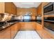 Gourmet kitchen featuring sleek wood cabinets, granite counters, stainless steel appliances and marble flooring at 2700 Las Vegas Blvd # 4101, Las Vegas, NV 89109