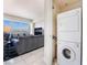View of the living room with furniture, large screen TV and in unit washer and dryer at 2700 Las Vegas Blvd # 4101, Las Vegas, NV 89109