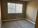 Neutral-toned bedroom featuring carpet and a large window for natural light at 2750 S Durango Dr # 2027, Las Vegas, NV 89117