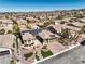 Expansive aerial view of a single-Gathering home with solar panels in a well-maintained desert community at 2776 White Sage Dr, Henderson, NV 89052