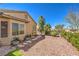 Low maintenance backyard with desert landscaping and a view of the home's exterior at 2776 White Sage Dr, Henderson, NV 89052