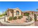 Private front courtyard featuring desert landscaping, a mature cactus, and decorative brick pavers at 2776 White Sage Dr, Henderson, NV 89052