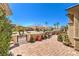 Private front courtyard featuring desert landscaping, decorative pavers, and an inviting seating area at 2776 White Sage Dr, Henderson, NV 89052