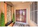 Double front door with a stone water feature, a welcome mat, and decorative window at 2776 White Sage Dr, Henderson, NV 89052