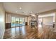 Hardwood floors and sliding glass doors to the back yard fill this living room with charm at 2776 White Sage Dr, Henderson, NV 89052